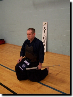 Lower left knee to the floor
