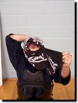 Wrap end behind your ear and tuck