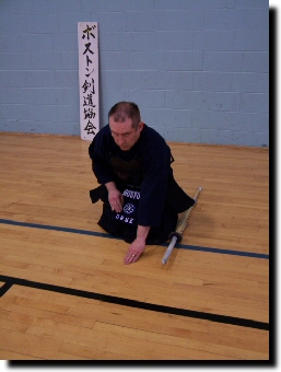 Place left hand on floor